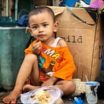 Enfant dans les rues de Kampung Sawah (mars 2020) - © Romain Mailliu